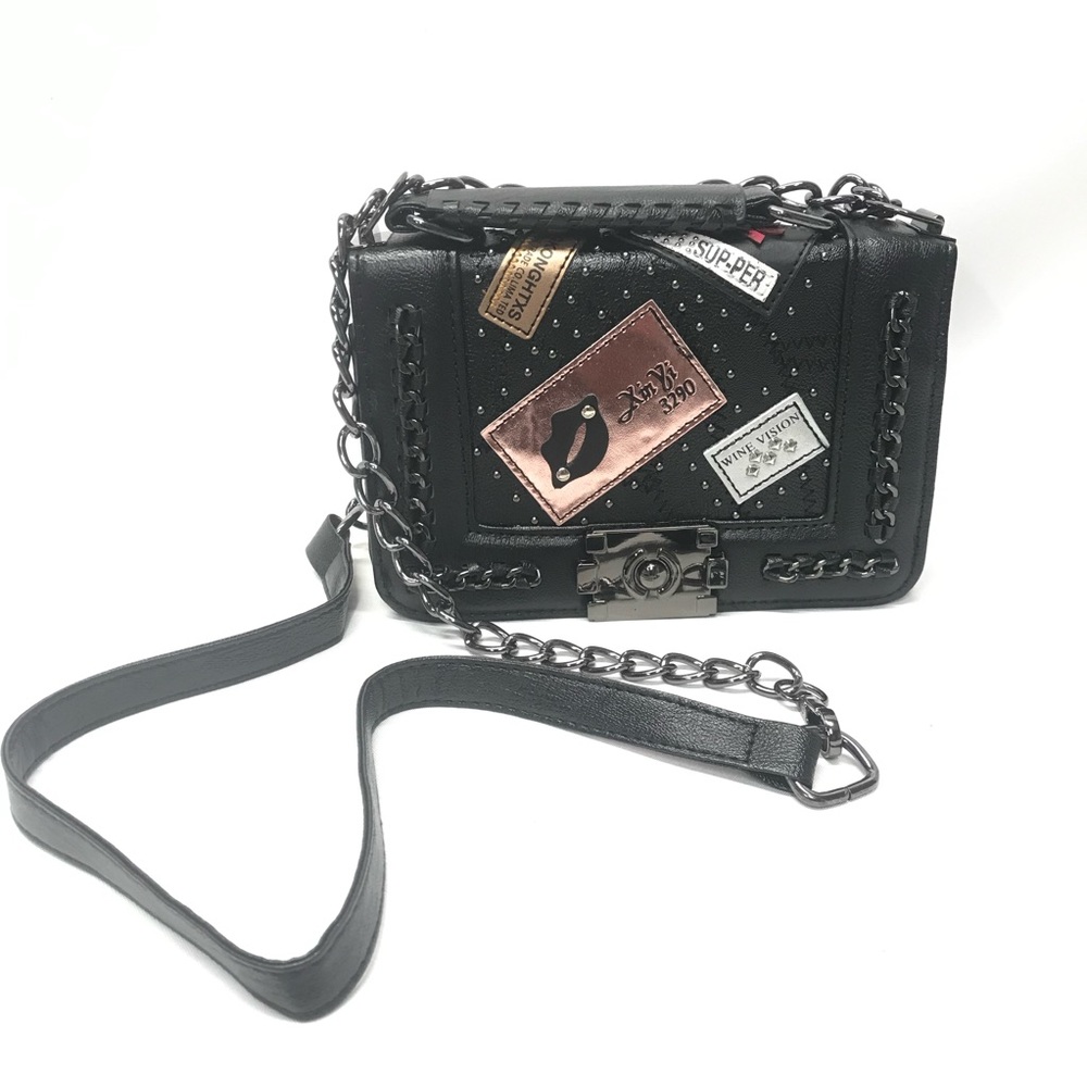Small black purse with patches